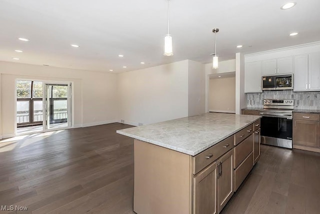 27500 Cedar Rd Unit 804, Beachwood, OH 44122 - kitchen with appliances with stainless steel finishes, dark wood finished floors, tasteful backsplash, a center island, and decorative light fixtures