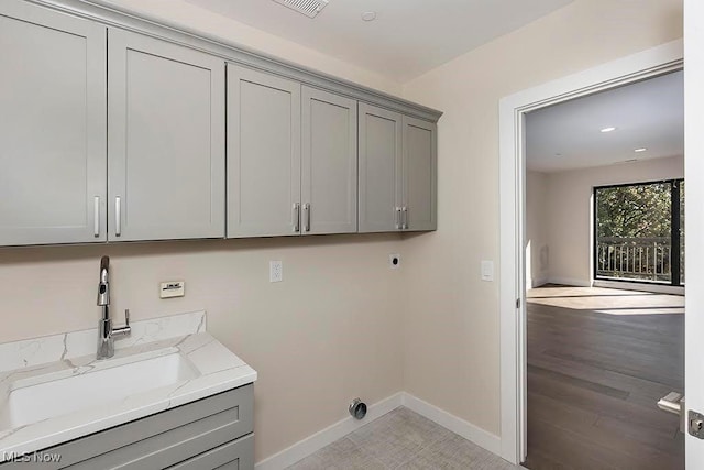 27500 Cedar Rd Unit 804, Beachwood, OH 44122 - laundry room with electric dryer hookup, cabinet space, baseboards, and recessed lighting