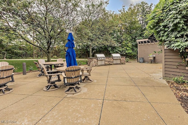 27500 Cedar Rd Unit 804, Beachwood, OH 44122 - view of patio / terrace featuring view of wooded area and outdoor dining space