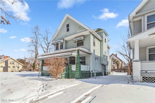 view of front of house featuring a residential view and covered porch