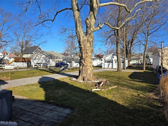 view of yard featuring a residential view