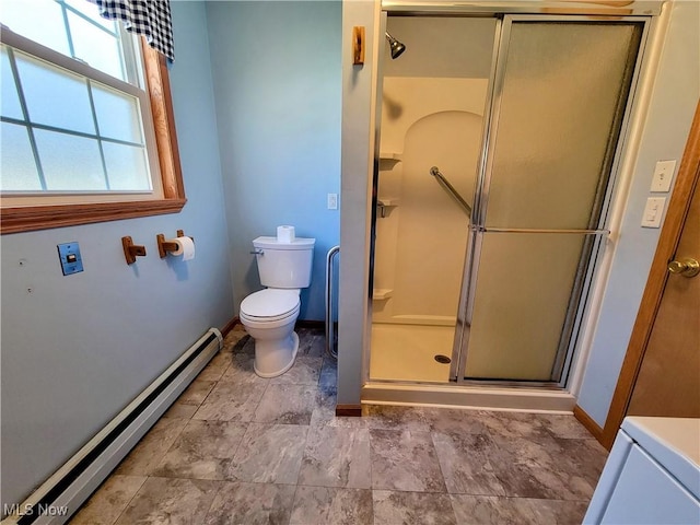 bathroom featuring a baseboard heating unit, baseboards, toilet, and a shower stall