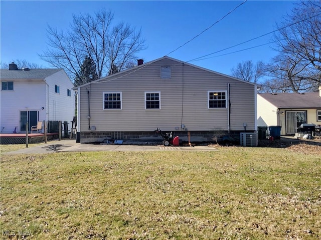 back of house with a patio area, cooling unit, a lawn, and fence