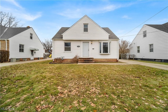 bungalow-style home with a front lawn