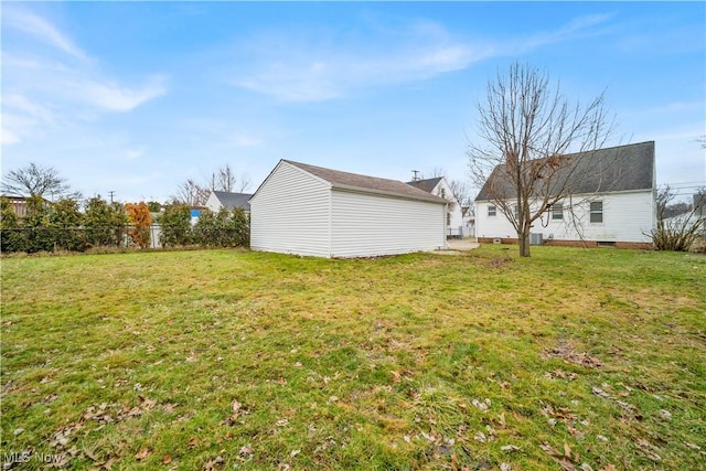 view of yard featuring an outdoor structure and fence