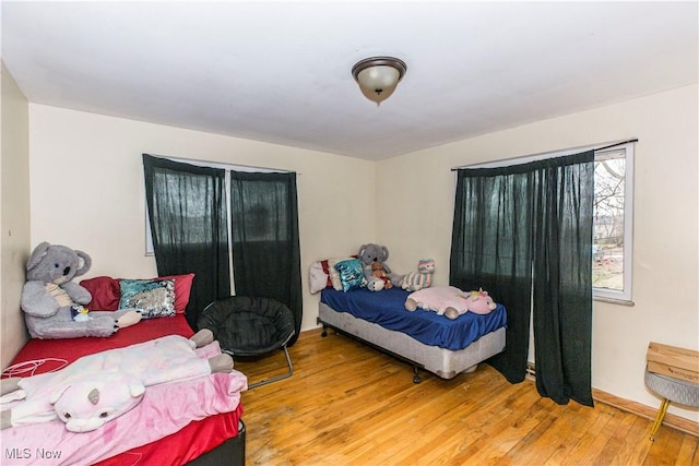 bedroom with light wood finished floors