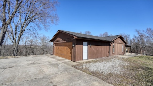 exterior space with a detached garage