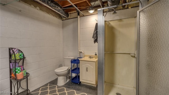 bathroom featuring a stall shower, toilet, and concrete flooring