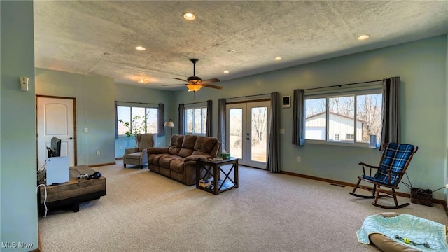 living room with recessed lighting, baseboards, carpet floors, and french doors