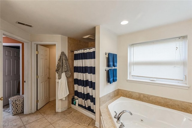 full bathroom featuring tile patterned flooring, a shower with curtain, visible vents, and a whirlpool tub