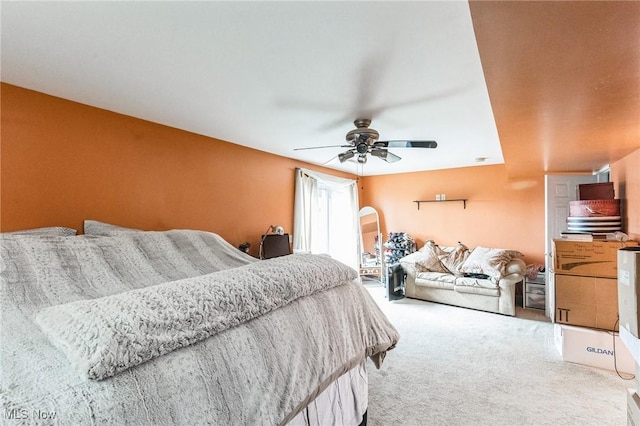 bedroom with a ceiling fan, carpet, and arched walkways