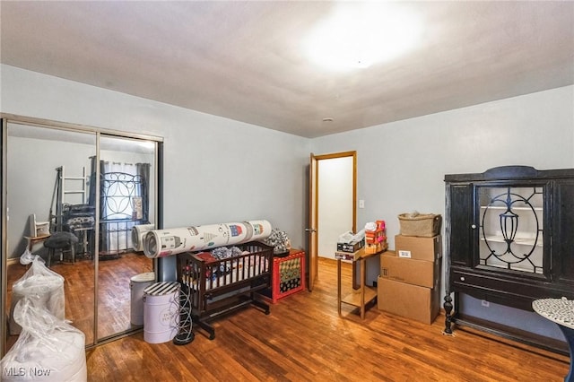 bedroom with wood finished floors