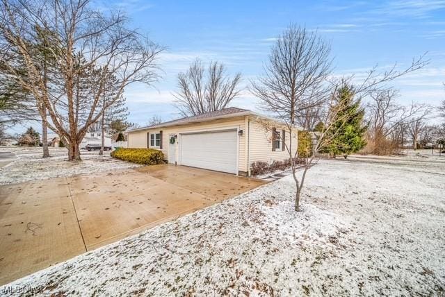 exterior space featuring concrete driveway