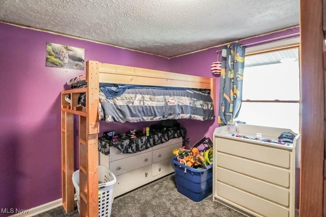 carpeted bedroom featuring a textured ceiling