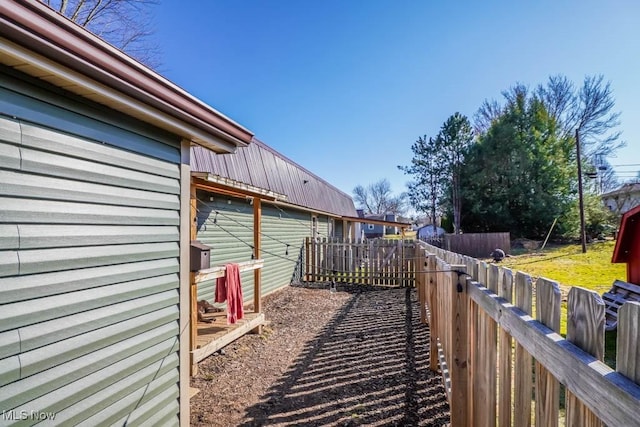 view of property exterior featuring fence