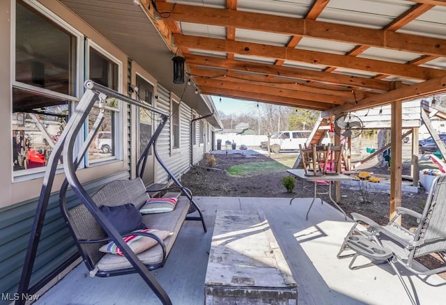 view of patio featuring fence