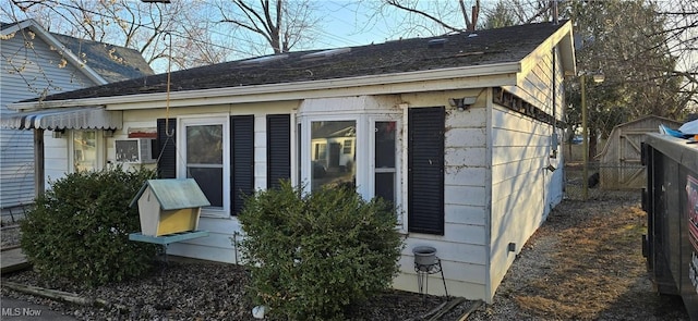 view of property exterior with fence