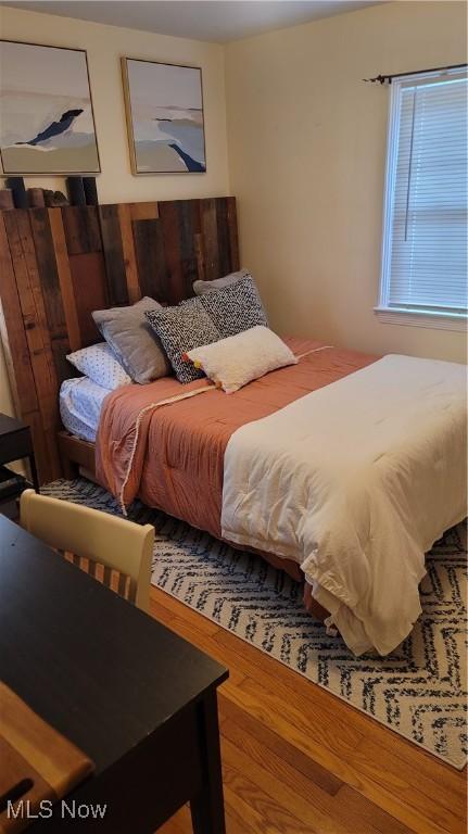 bedroom with wood finished floors