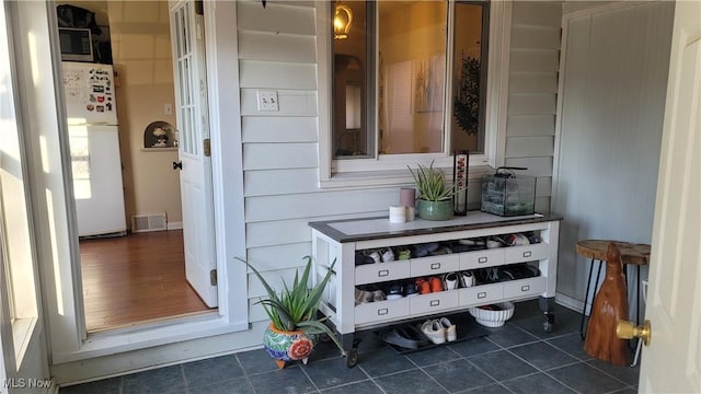 doorway to property with visible vents