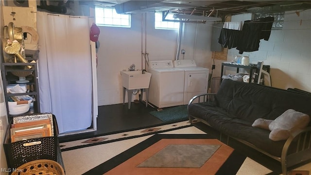 laundry room featuring washer and dryer, laundry area, and a sink