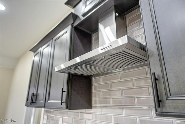 kitchen with wall chimney range hood