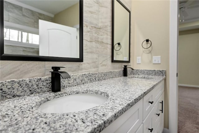 full bath featuring a sink and double vanity