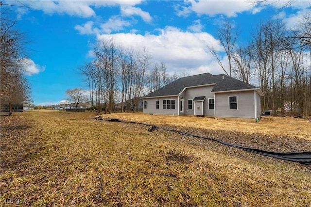 back of house with a yard