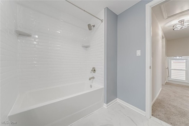 full bathroom with baseboards, marble finish floor, and shower / washtub combination