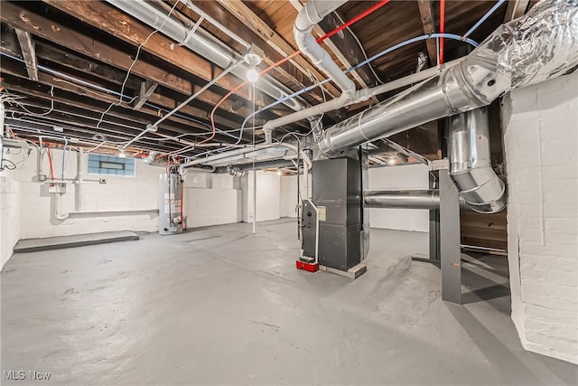 below grade area featuring heating unit and water heater