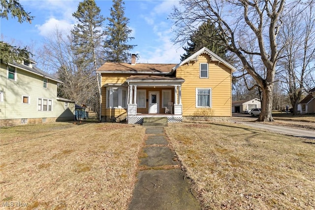 view of front of property featuring a porch and a front lawn