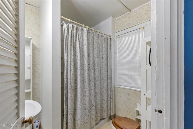 bathroom with tile patterned flooring, a shower with shower curtain, and toilet