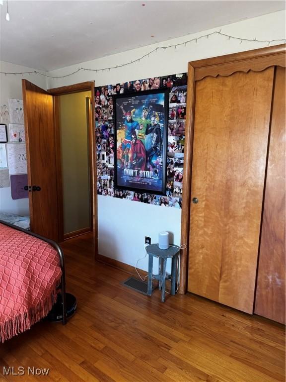 bedroom with wood finished floors