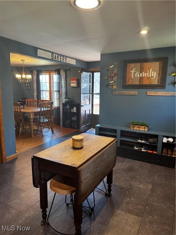 game room featuring a notable chandelier