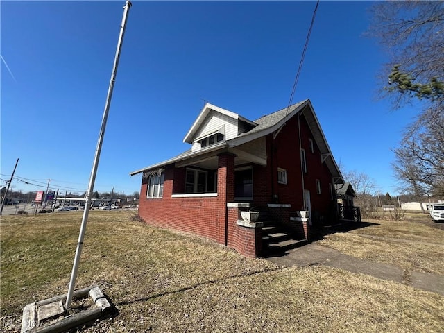 view of side of property with brick siding