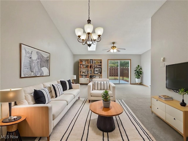 living room featuring ceiling fan with notable chandelier and light carpet