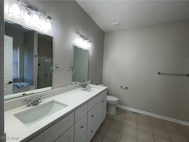 full bathroom with a stall shower, visible vents, and a sink