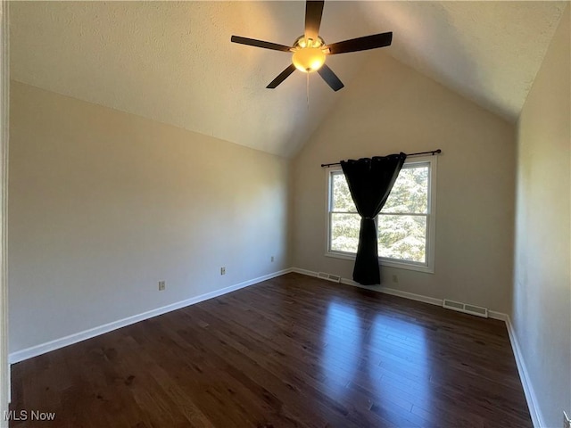 unfurnished room featuring visible vents, dark wood-style flooring, and baseboards