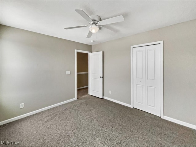 unfurnished bedroom with a closet, baseboards, ceiling fan, and carpet flooring