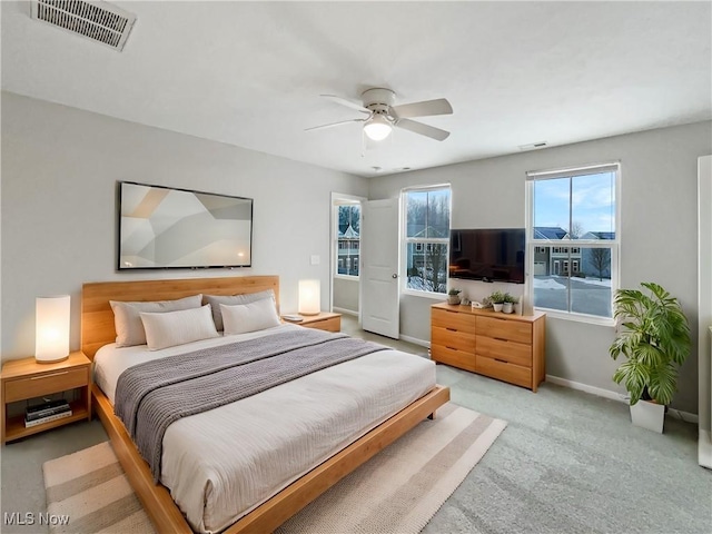 bedroom featuring visible vents, ceiling fan, baseboards, and carpet floors