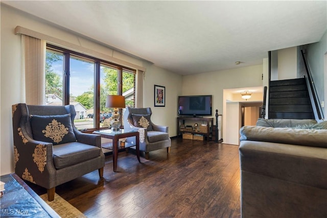 living room featuring stairway and wood finished floors