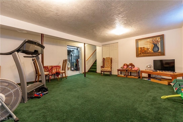 interior space featuring a textured ceiling and carpet