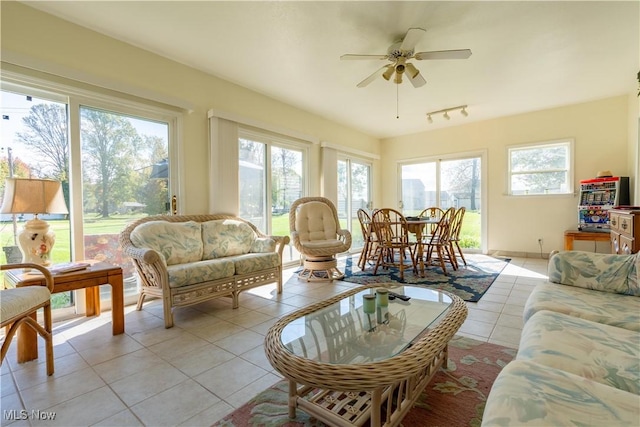 sunroom with track lighting and a ceiling fan