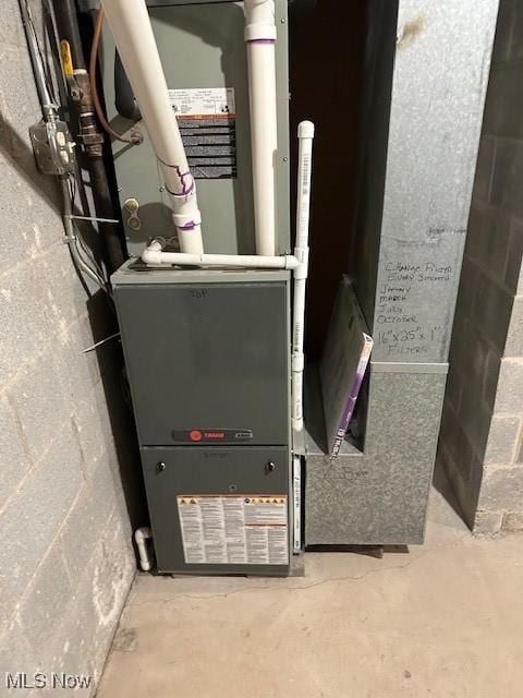 utility room with heating unit
