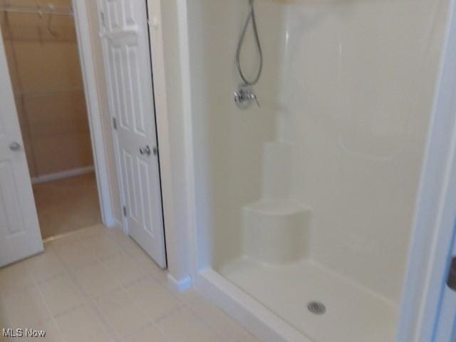 bathroom with a shower stall