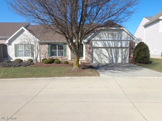 view of front of property featuring an attached garage and driveway