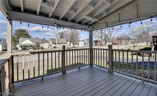 wooden terrace with a residential view