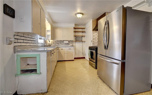 kitchen featuring backsplash, light floors, light countertops, appliances with stainless steel finishes, and open shelves