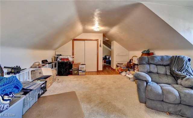 bonus room featuring vaulted ceiling and carpet floors