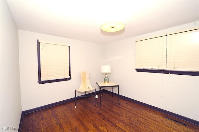 174 N Vine St, Columbiana, OH 44408 - empty room with wood finished floors and baseboards