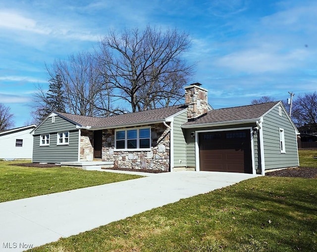 ranch-style home featuring a front yard, a chimney, driveway, stone siding, and an attached garage